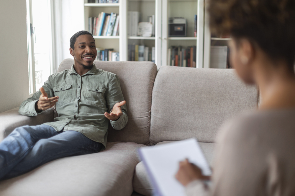 a black young man in therapy for depression as a result of cocaine addiction