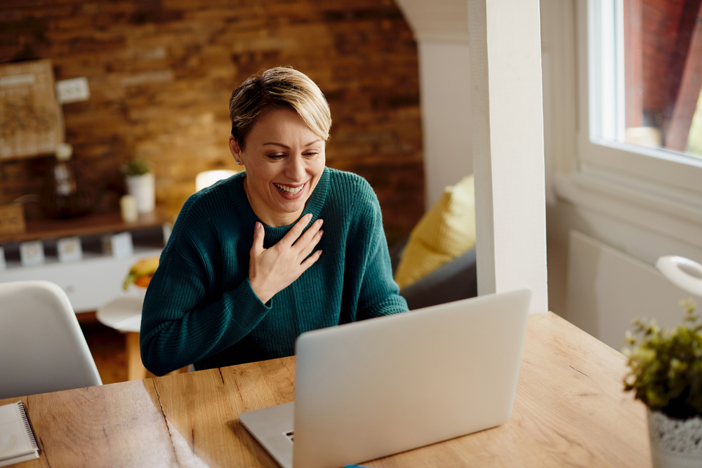 A happy patient engaged in a virtual IOP session for prescription drug abuse