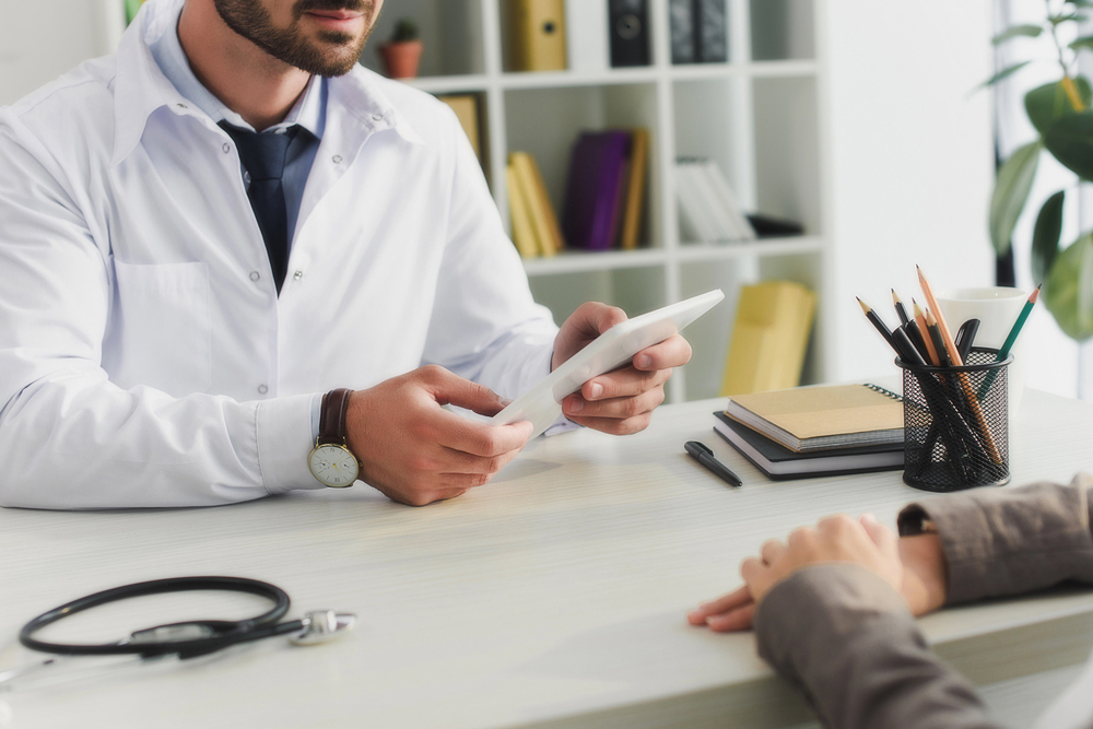 A cropped image of a doctor giving a prescription concept image of prescription stimulant drugs