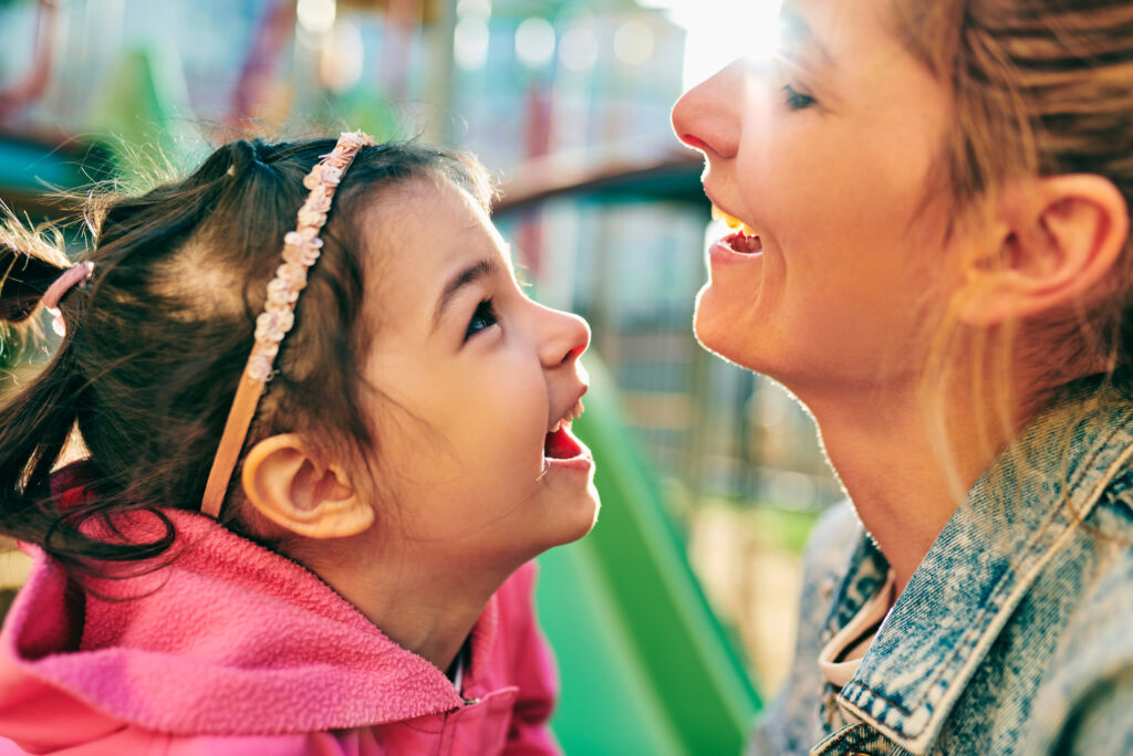 A woman celebrating with her kid after finishing individual therapy for illicit stimulants treatment.